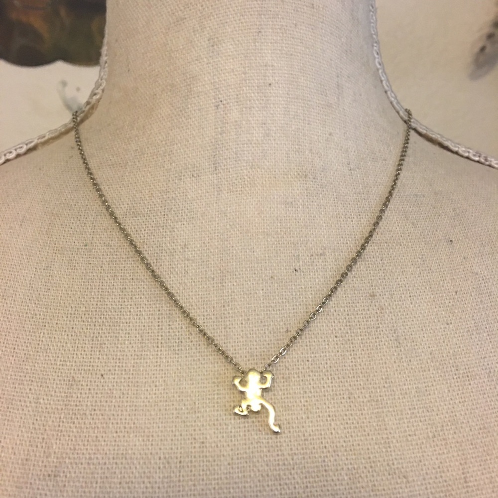 Charming Charlie gold tone frog pendant on chain